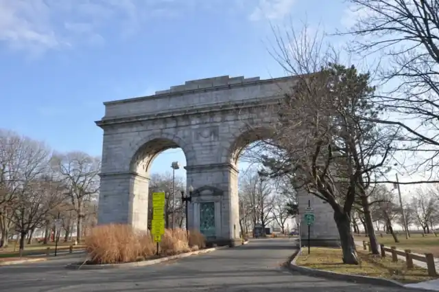 Perry Memorial Arch, a stone arch with a road through it, at Seaside Park in Bridgeport in winter